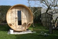 Outdoor wooden sauna in the garden.