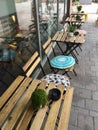 Outdoor wooden tables and chairs in a town