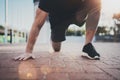 Outdoor Workout lifestyle concept.Young man doing stretch exercises muscles before training.Muscular athlete exercising Royalty Free Stock Photo