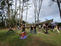 Outdoor Yoga class, led by Kara Miller, does warrior two