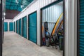 Outdoors activity items seen through the open door of the self storage unit. Rental Storage Units Royalty Free Stock Photo