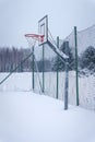 Outdoors basketball court covered with snow in winter