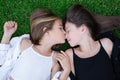 Outdoors closeup portrait of two adorable children share love and friendship. Two sisters having fun on sunlight and Royalty Free Stock Photo