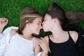 Outdoors closeup portrait of two adorable children share love and friendship. Two sisters having fun on sunlight and Royalty Free Stock Photo