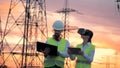 Outdoors ETL with two technicians working with computers using VR headset.