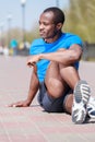 Outdoors exercising. Young african decsent men doing his outdoor Royalty Free Stock Photo