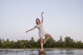 Outdoors fashion photo of beautiful bohemian lady at river.