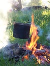 Outdoors on the fire of firewood cooked in a pot tourist s food