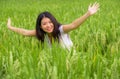 Young beautiful and happy Asian Chinese tourist girl having fun feeling free at tropical rice field enjoying exotic holidays trip