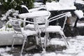 Outdoors garden table and chairs buried in snow drift Royalty Free Stock Photo