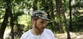 Outdoors horizontal portrait of happy hiker young man with red beard, feel good after hiking in forest. Traveler bearded male Royalty Free Stock Photo