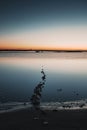 Outdoors lake at sunset. Soft sunlight, glowing pink and golden clouds, reflection in a crystal clear water. Idyllic landscape. Royalty Free Stock Photo