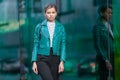Outdoors lifestyle fashion portrait of stunning brunette girl. Walking on the city street. Going shopping. Dressed in a Royalty Free Stock Photo