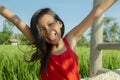 Outdoors lifestyle portrait of beautiful and sweet young girl smiling happy and cheerful, the excited child dressed in a cute red Royalty Free Stock Photo