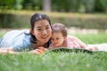 outdoors lifestyle portrait of mother and daughter - young happy and sweet Asian Korean woman playing with her 8 months baby girl Royalty Free Stock Photo