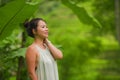 Outdoors lifestyle portrait of young attractive and happy Asian Chinese tourist woman enjoying relaxed the beautiful view