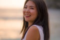 Outdoors lifestyle portrait of young beautiful and happy Asian Chinese woman in Summer dress enjoying cheerful walk at tropical Royalty Free Stock Photo