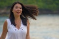 Outdoors lifestyle portrait of young beautiful and happy Asian Chinese woman in Summer dress enjoying cheerful walk at tropical Royalty Free Stock Photo