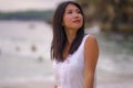 Outdoors lifestyle portrait of young beautiful and happy Asian Chinese woman in Summer dress enjoying cheerful walk at tropical Royalty Free Stock Photo