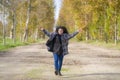 Outdoors lifestyle portrait of young happy and pretty Asian Japanese woman jumping carefree and cheerful at beautiful city park in Royalty Free Stock Photo