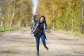 Outdoors lifestyle portrait of young happy and pretty Asian Korean woman jumping carefree and cheerful at beautiful city park in Royalty Free Stock Photo