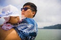 Outdoors lifestyle portrait of young happy and proud Asian Chinese man as loving father holding adorable daughter baby girl during Royalty Free Stock Photo