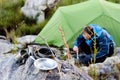 Outdoors man cooking Royalty Free Stock Photo