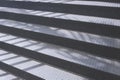 Outdoors metal staircase background with light and shadow on steel steps surface in perspective side view Royalty Free Stock Photo