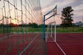 Outdoors mini football and basketball court with ball gate and basket surrounded with high protective fence Royalty Free Stock Photo