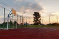 Outdoors mini football and basketball court with ball gate and basket surrounded with high protective fence Royalty Free Stock Photo