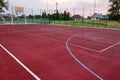 Outdoors mini football and basketball court with ball gate and basket surrounded with high protective fence Royalty Free Stock Photo