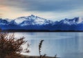 Outdoors nature awesome beauty landscape frozen winter lake snowy mountains in the background cloudy day travel destinations Royalty Free Stock Photo