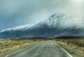 Outdoors nature landscape trip route empty road winter snowy mountains background cloudy fog day Calafate Patagonia Argentina Royalty Free Stock Photo