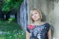 Outdoors park portrait of mature woman at green alley background Royalty Free Stock Photo