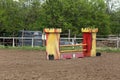 Outdoors photo of wooden barriers for jumping horses. Preparation of horses for performance on equestrian training Royalty Free Stock Photo