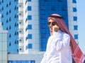 Outdoors portrait of an arabian man talking on a cell ph Royalty Free Stock Photo