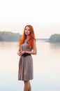 Outdoors portrait of beautiful confident woman with red hair, co Royalty Free Stock Photo