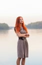 Outdoors portrait of beautiful confident woman with red hair, co Royalty Free Stock Photo