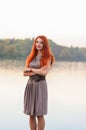 Outdoors portrait of beautiful confident woman with red hair, co Royalty Free Stock Photo