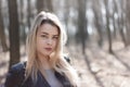 Outdoors portrait of beautiful young brunette girl. Woman smiling happy on sunny summer or spring day outside on city background. Royalty Free Stock Photo