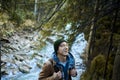Outdoors portrait positive man hiker by the river at the forest, enjoying fresh air Royalty Free Stock Photo