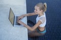 Outdoors portrait of pretty blonde woman with laptop computer Royalty Free Stock Photo