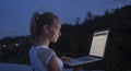 Outdoors portrait of pretty blonde woman with laptop computer Royalty Free Stock Photo