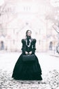 Outdoors portrait of a victorian lady in black