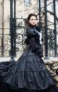 Outdoors portrait of a victorian lady in black Royalty Free Stock Photo