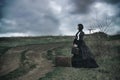 Outdoors portrait of a victorian lady in black Royalty Free Stock Photo