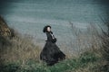 Outdoors portrait of a victorian lady in black. Royalty Free Stock Photo