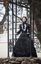 Outdoors portrait of a victorian lady in black Royalty Free Stock Photo