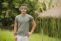 Outdoors portrait of young attractive and happy hipster man enjoying tropical nature exploring exotic Asian tourist destination Royalty Free Stock Photo