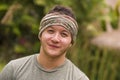 Outdoors portrait of young attractive and happy hipster man enjoying tropical nature exploring exotic Asian tourist destination Royalty Free Stock Photo